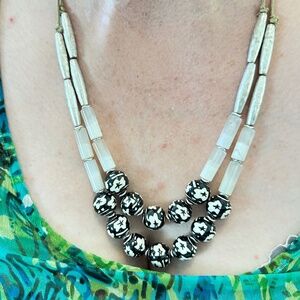 Silver tone tubes, Black & white beaded layer necklace on adjustable tan cord